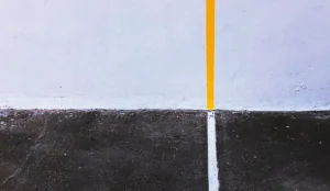 a yellow line on a black surface