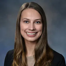 a woman with long hair smiling