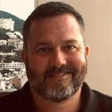 a man smiling for the camera