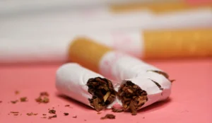 a broken cigarette with brown tobacco