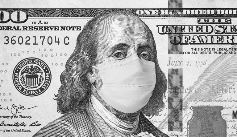 a man wearing a face mask on a hundred dollar bill