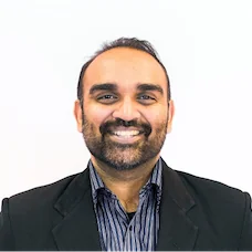 a man smiling at the camera