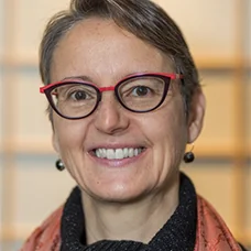 a woman wearing glasses and a scarf