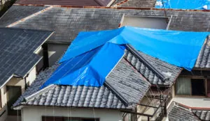 a blue tarp on a roof
