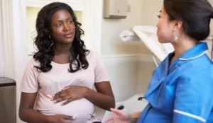 pregnant woman and healthcare worker