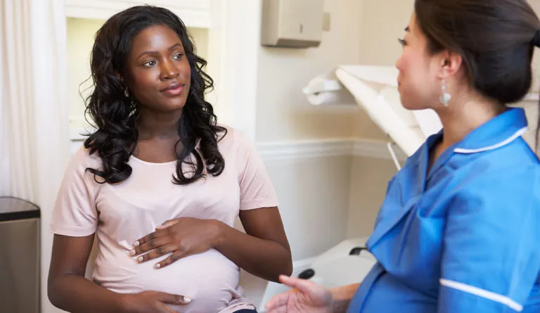 pregnant woman and healthcare worker