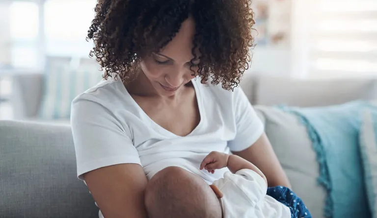 woman breastfeeding baby