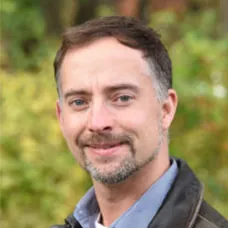 a man smiling for a picture