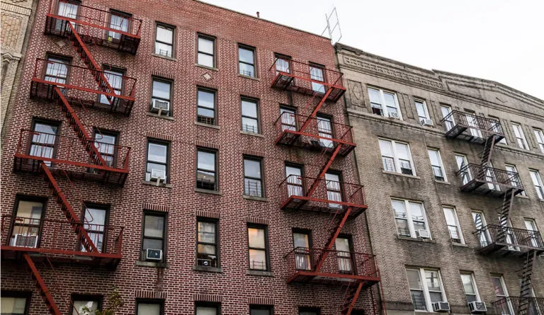 a building with red fire escape