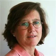 a woman wearing glasses and a pink shirt