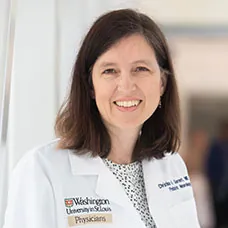 a woman in a white coat