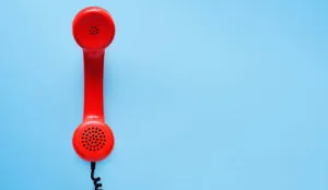 red telephone on blue background