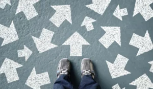a person standing in front of arrows