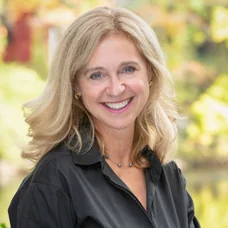 a woman smiling at camera
