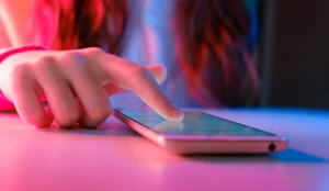 a finger touching a phone