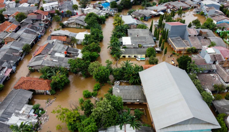 a flooded neighborhood with trees and buildings