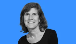 a woman smiling with a blue background