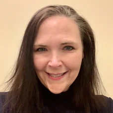 a woman smiling at camera