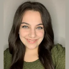 a woman smiling for a selfie