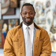 a man in a brown jacket
