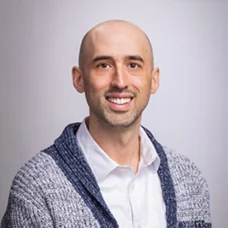 a man smiling for a picture