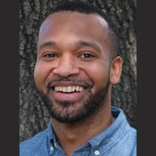 a man smiling for a picture