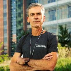a man standing with his arms crossed