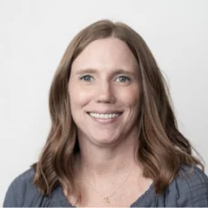 a woman smiling at the camera