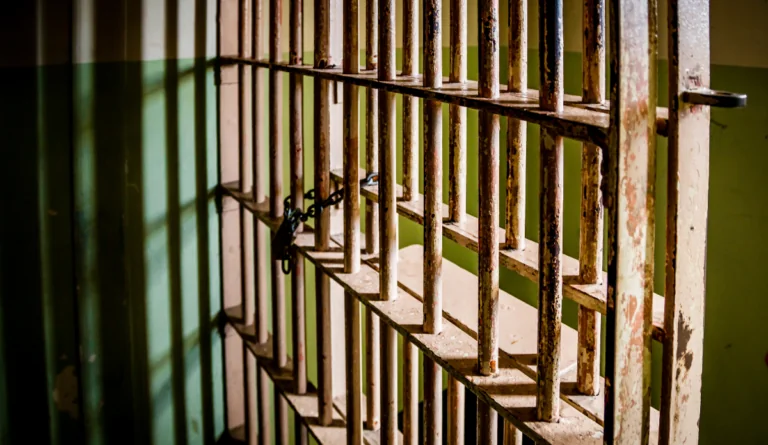 close up of prison cell bars