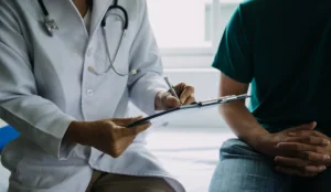 Doctor conducting cancer screening on patient