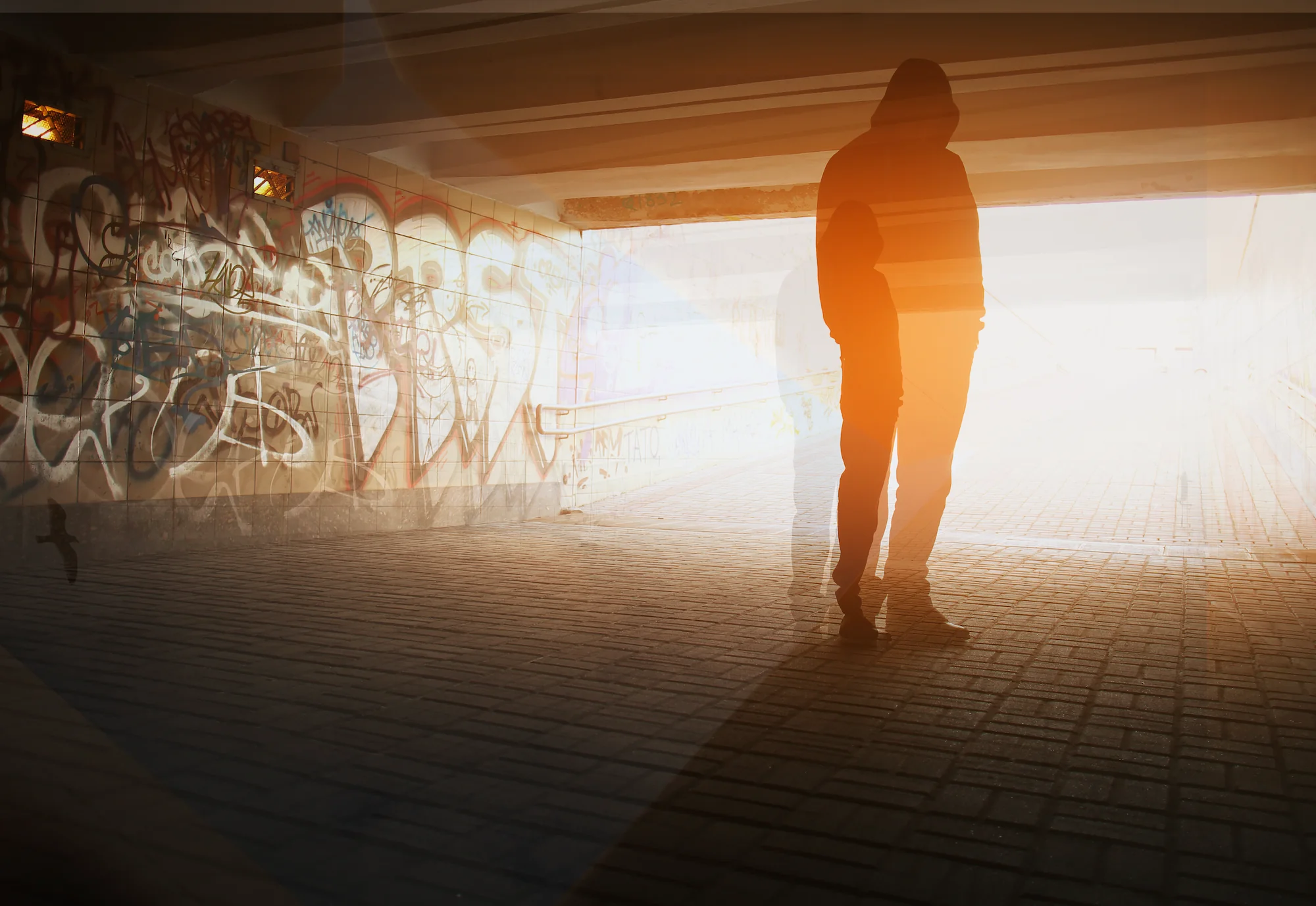 a person standing in a tunnel