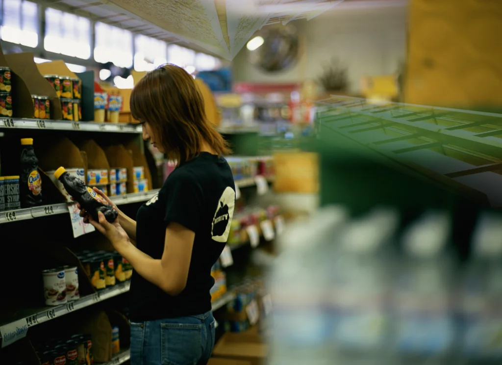 a woman looking at a product in a store