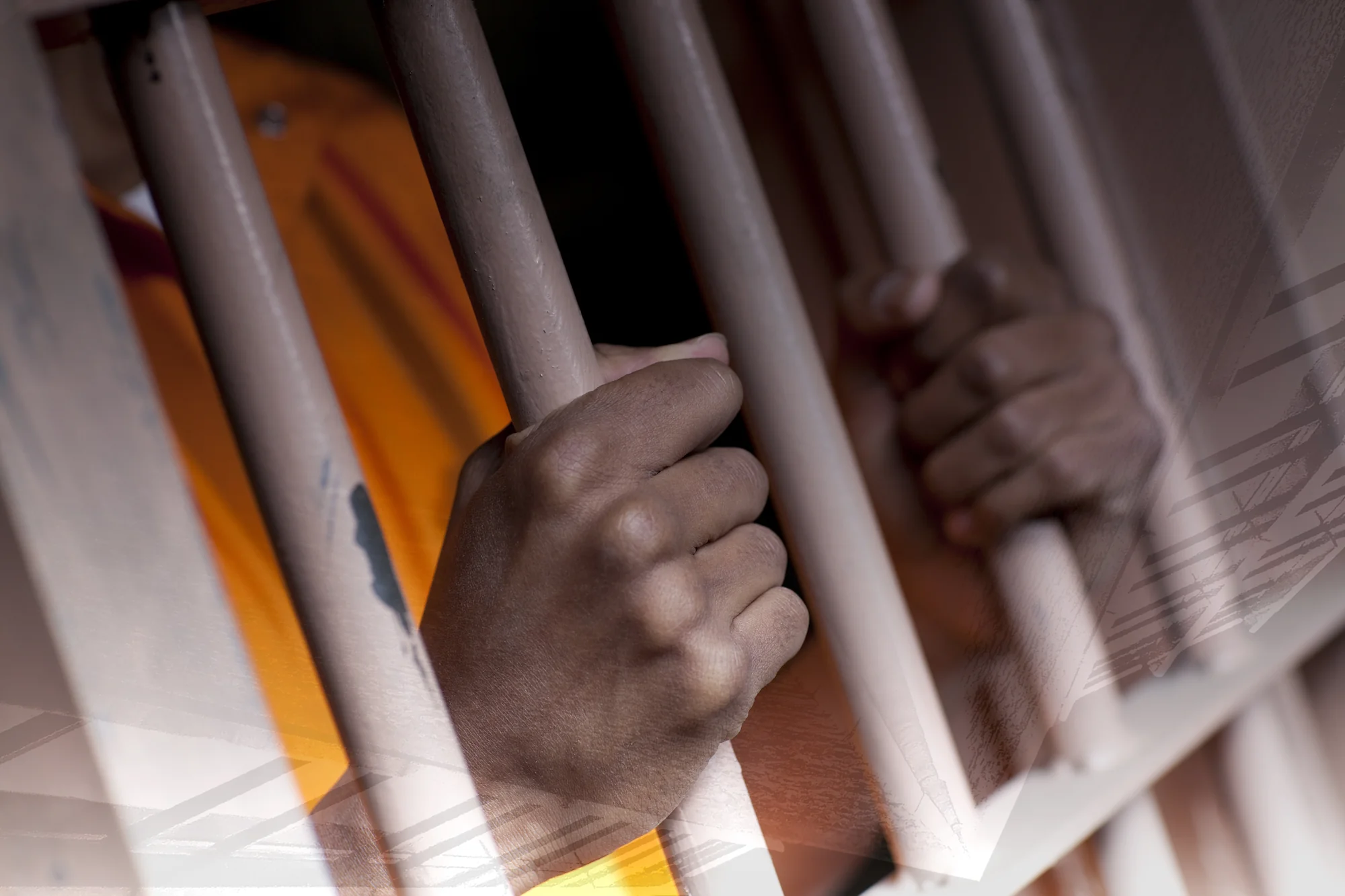 a close-up of hands holding bars