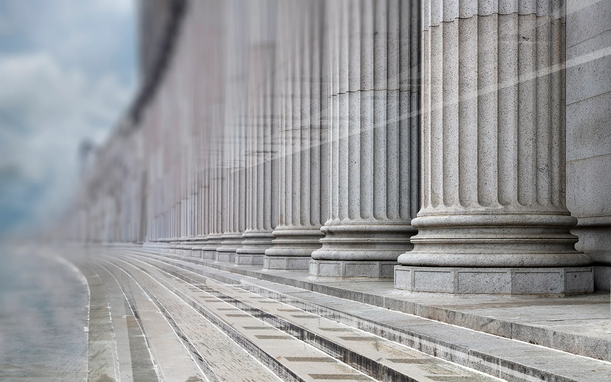 a row of pillars on a sidewalk