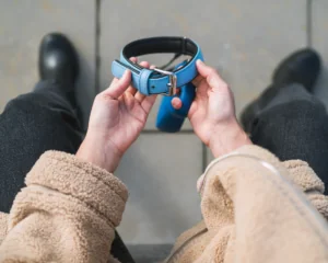 person holding an animal collar, grieving. pet loss concept