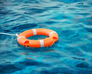 Life preserver floating in water