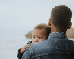 young father holding child