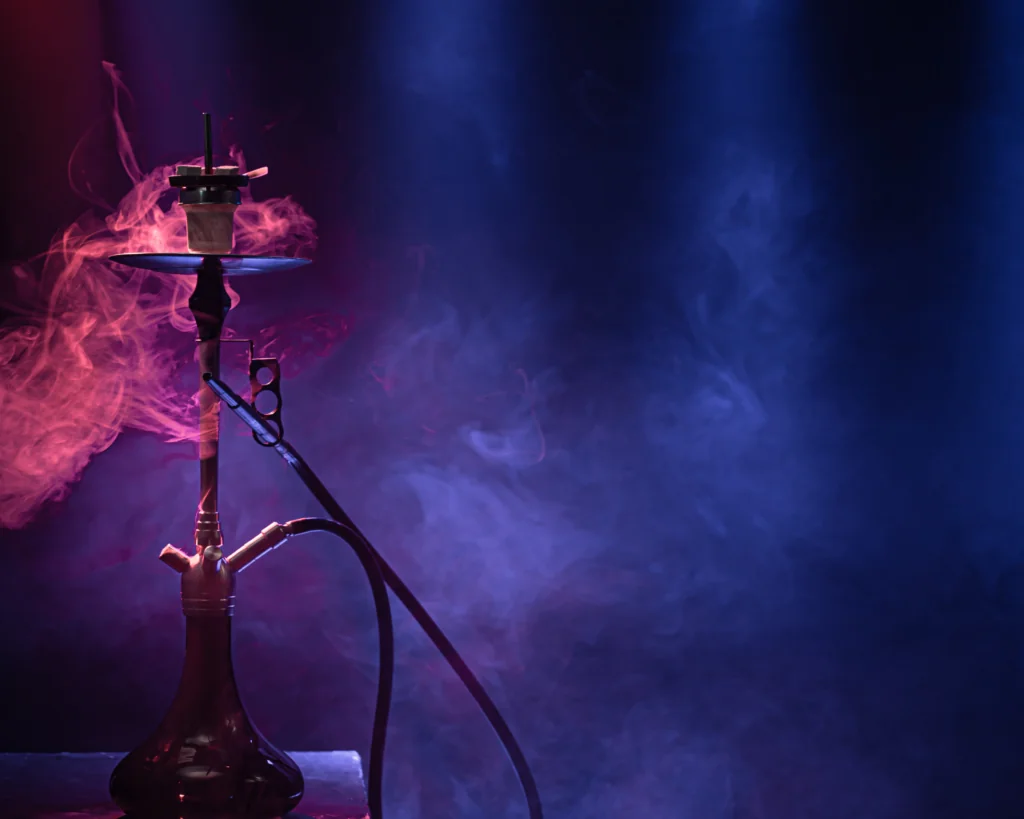 A classic hookah with colorful rays of light and smoke in background