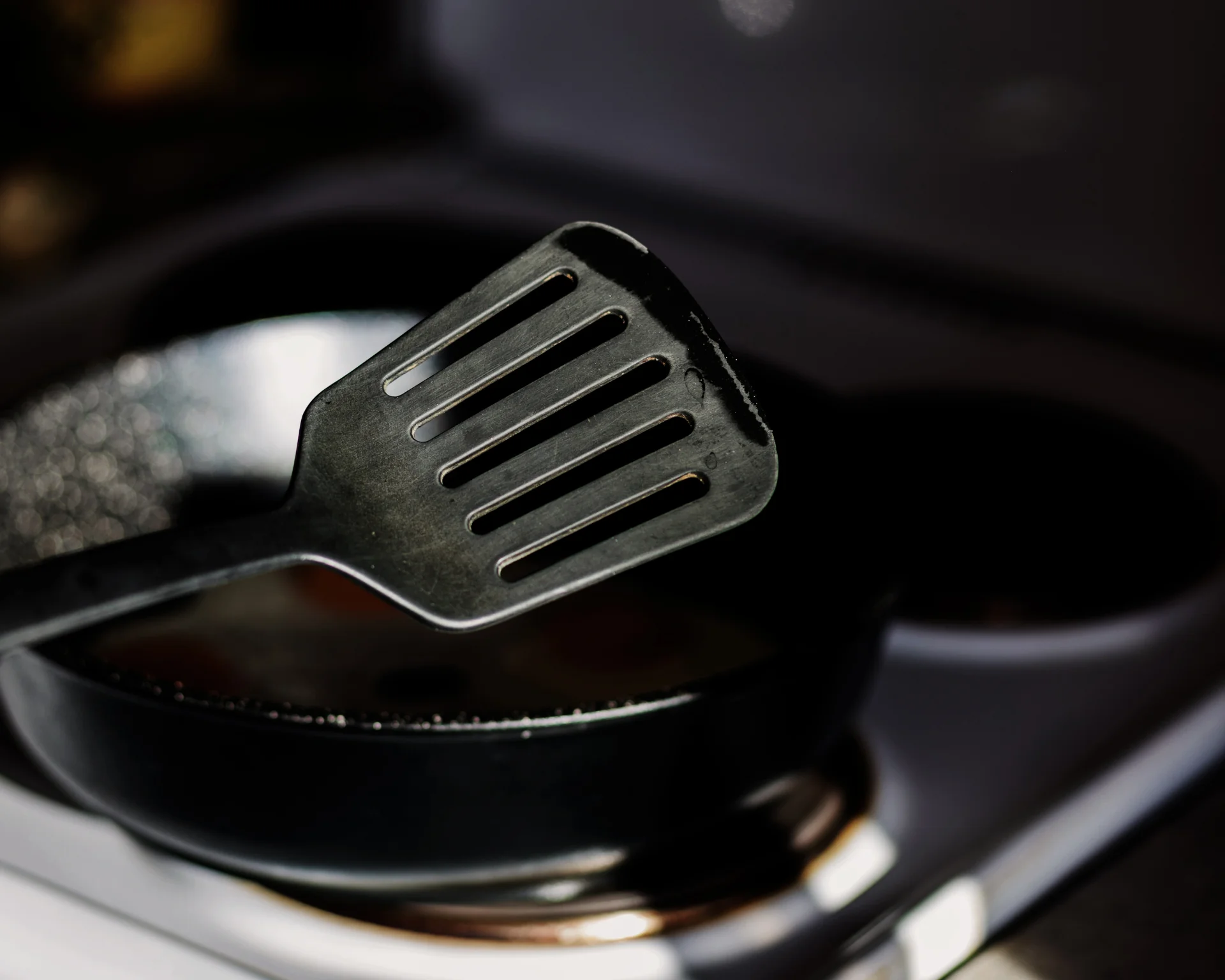 Black plastic kitchen spatula