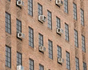 Exterior of urban building with windows and air conditioning units