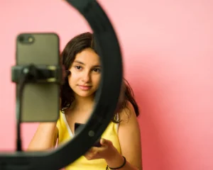 Young kidfluencer filming a video