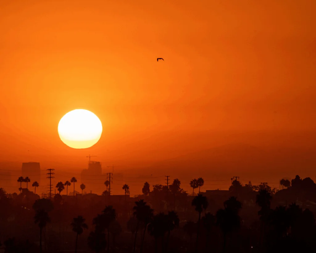 A hot summer sun rises over Los Angeles during a summer heatwave