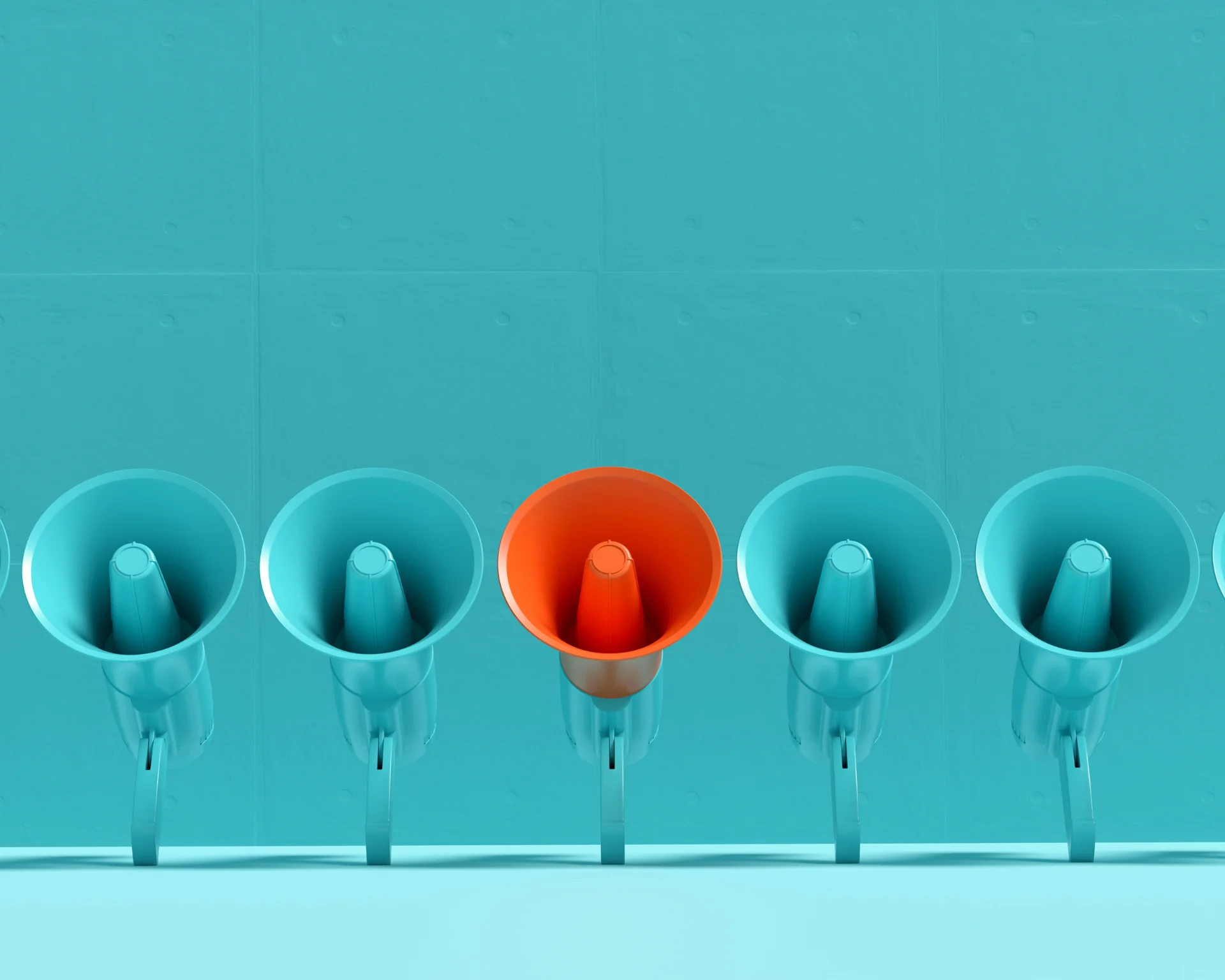 Blue megaphones in a row with one of them is in orange color on blue background. Concept of a differing message