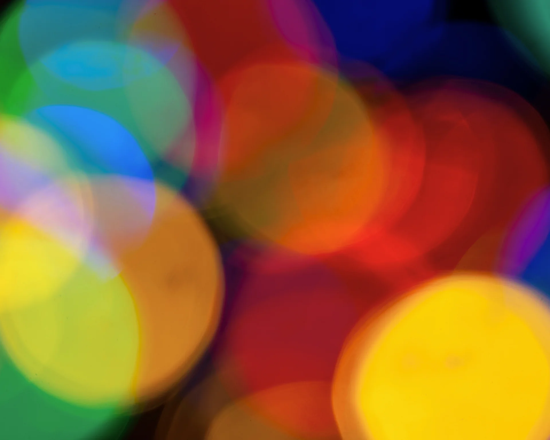 Blurry multicolored garland with glowing lights. Christmas, new year, birthday and wedding concept