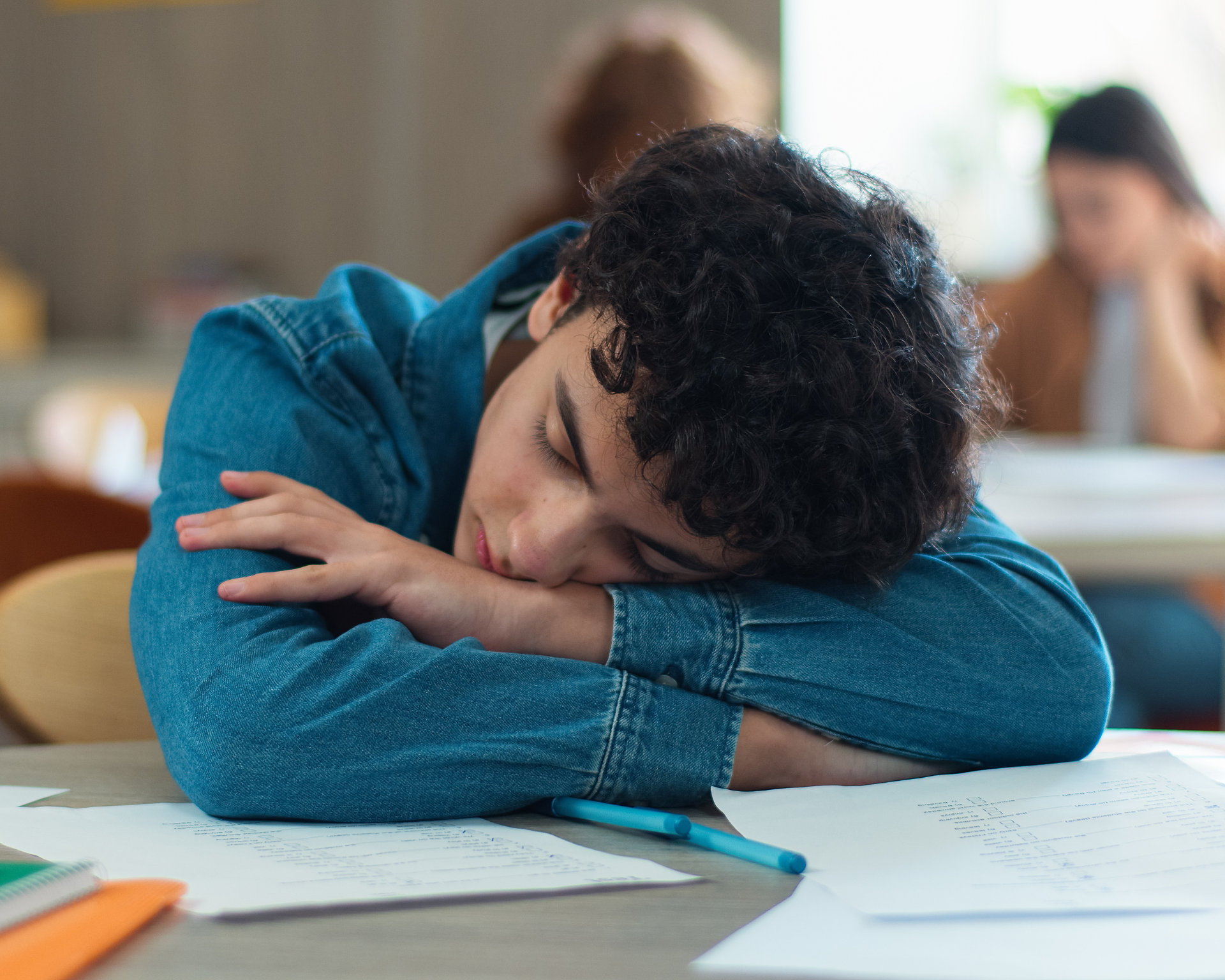 Tired sleepy napping exhausted fatigued overworked overload pupil teen boy teenager sleep student