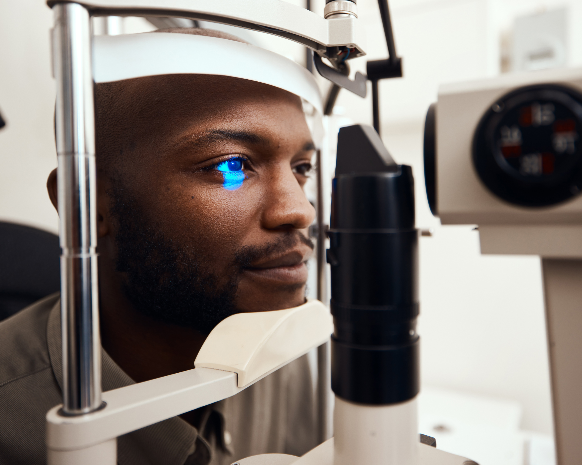Shot of a young Black man getting his eyes examined. Glaucoma concept