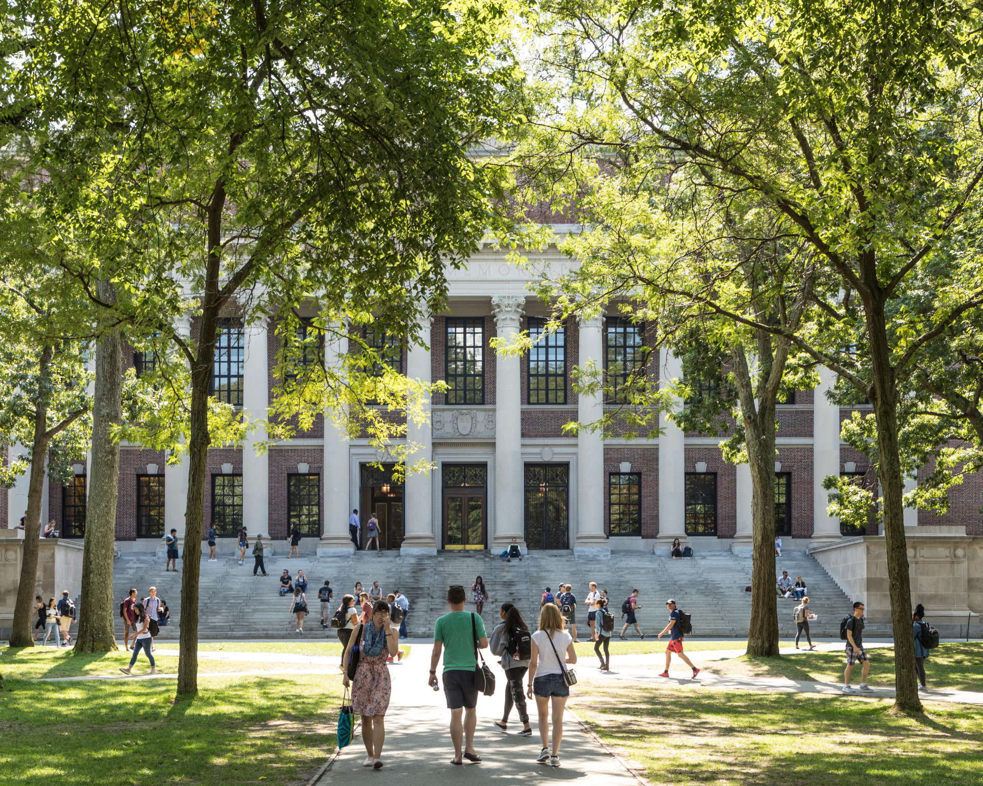 Students walking across campus quad on a sunny day