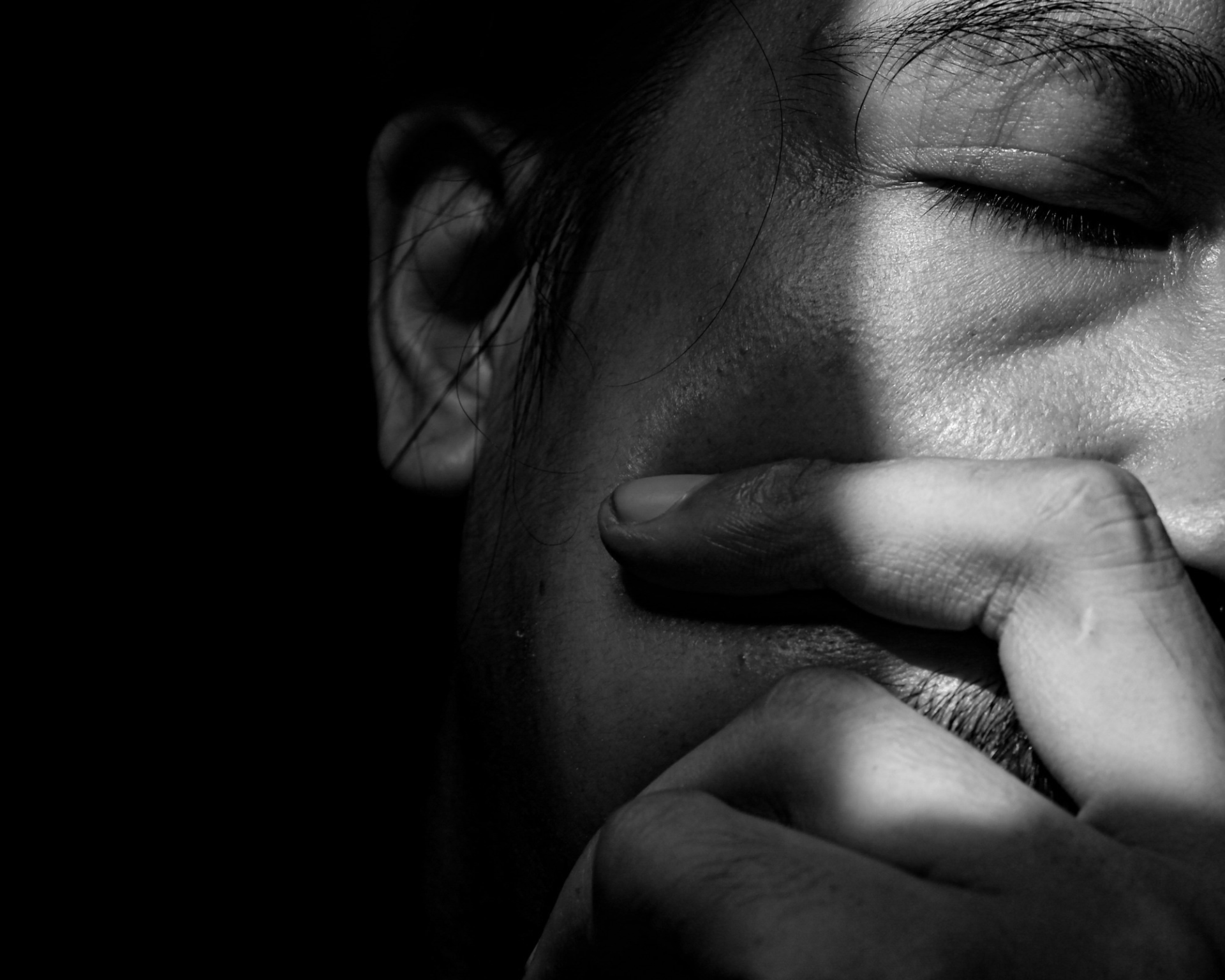 Portrait of a Man in Darkness Reflecting Mental Health Struggles