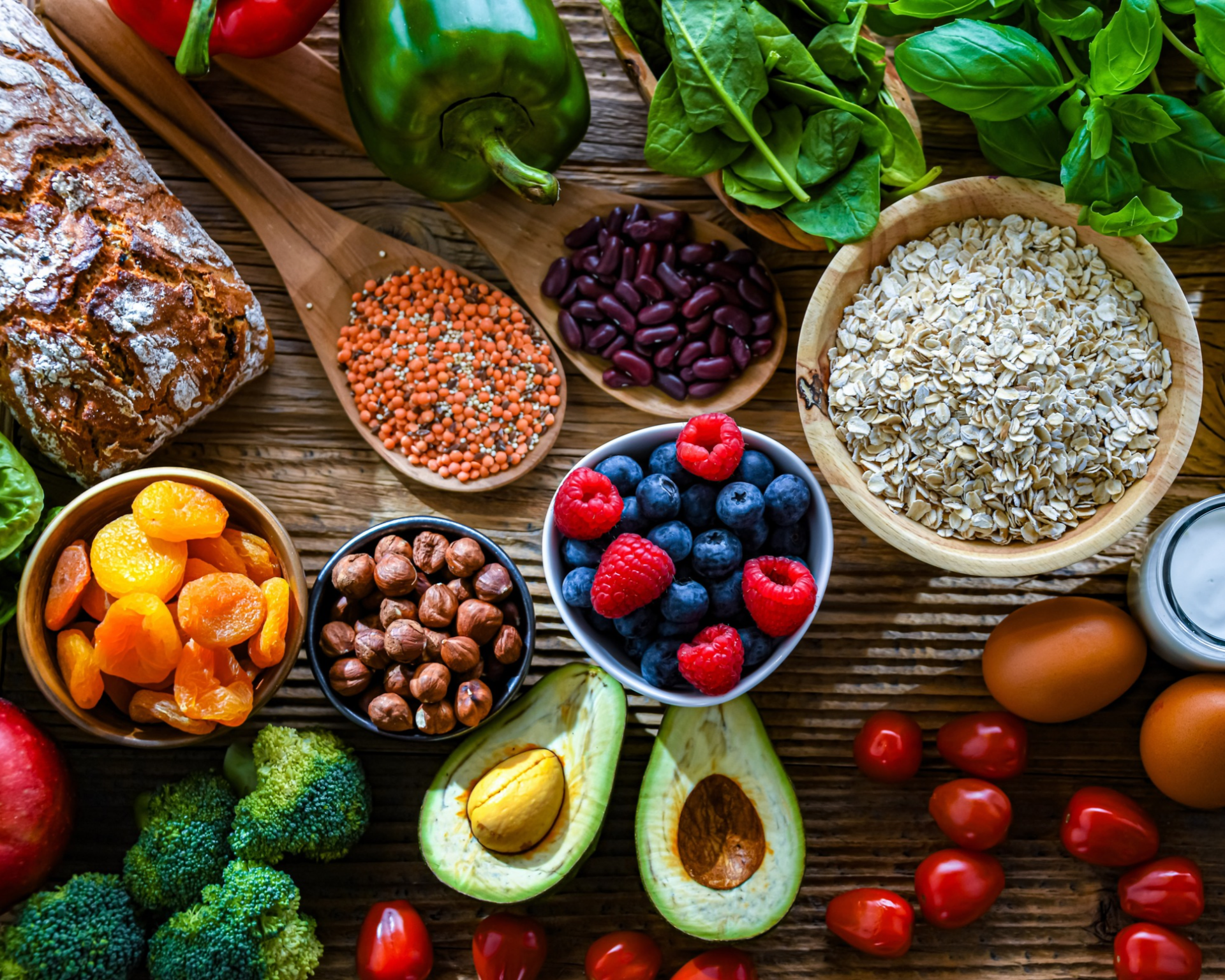 Flatlay of various fruits, vegetables, and grains to show a balanced, healthy diet